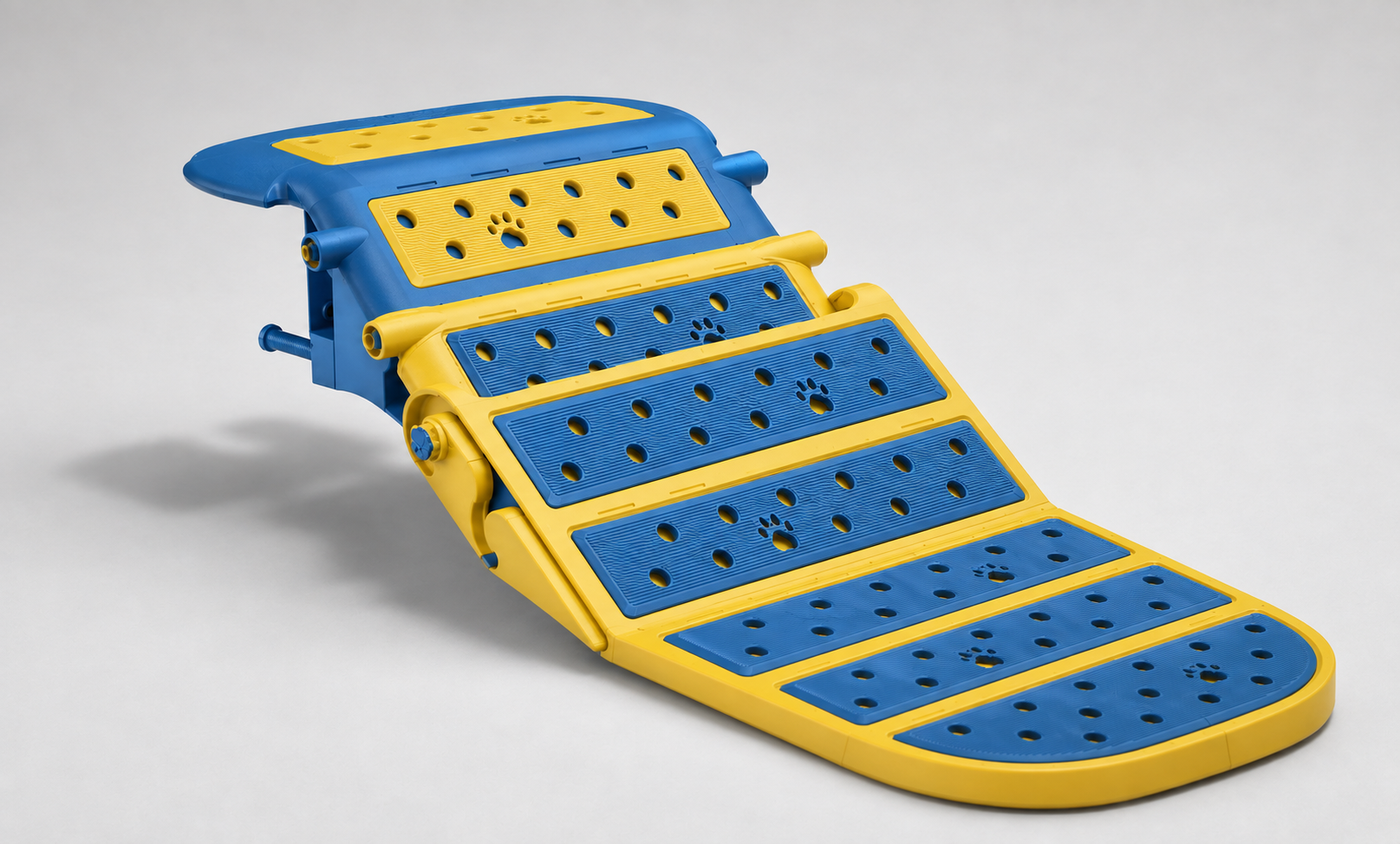Blue and yellow PuppyDock pool ramp, showing its grip surfaces and hinged sections