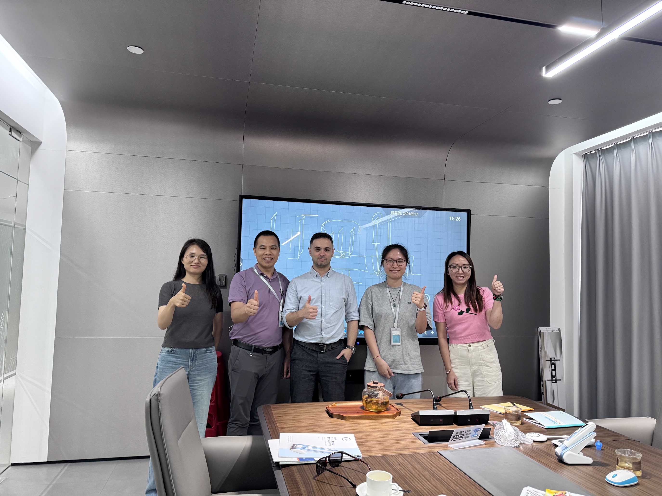 Marco meeting with manufacturing partners in a conference room