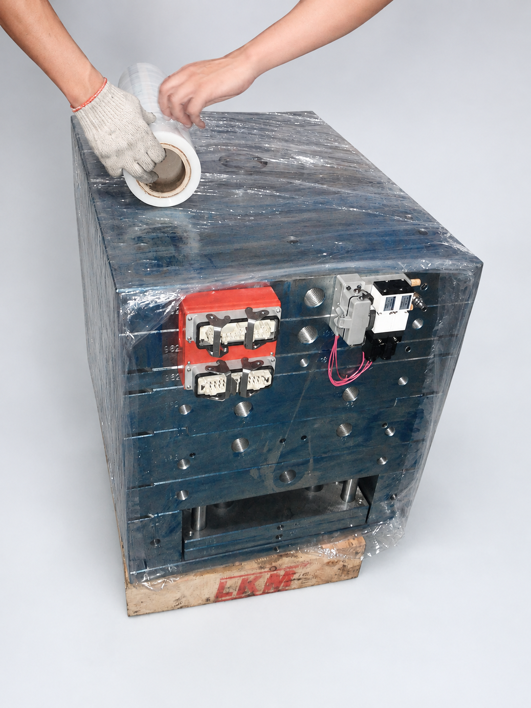 Styled view of protective film being applied around the mould